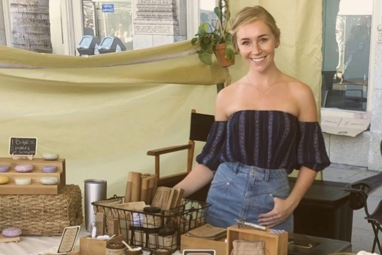 Featured Image, Owner Stephanie Cochrane smiles as she sells her The Waste Less shop items.