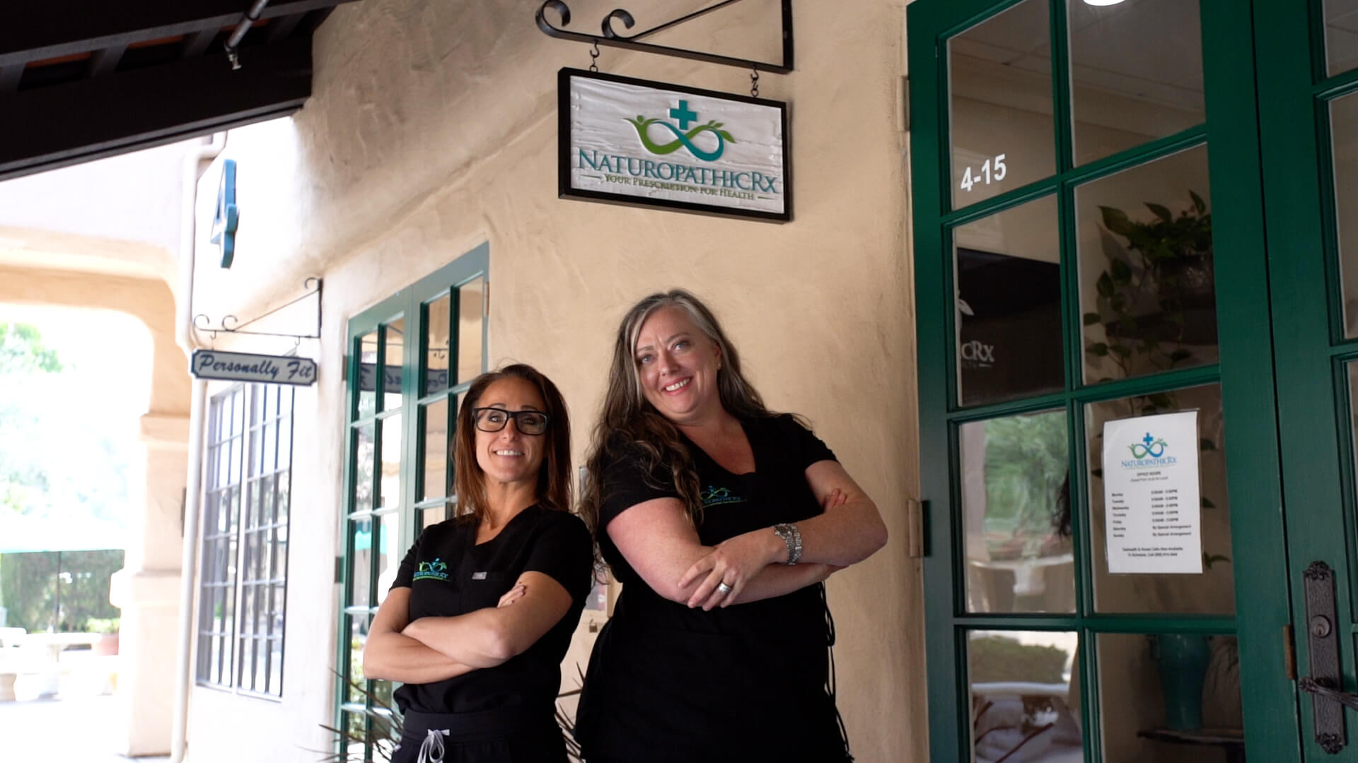 Naturopathic owners outside front of the store