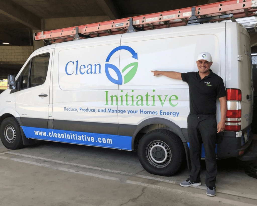 man standing in front of a white Clean Initiative van