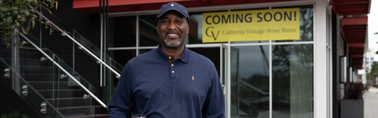 Earnest Ross stands outside of California Vintage Wine Bistro's future home in Anaheim. 