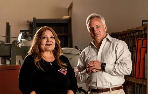(From left) Terry and CDC Small Business Finance loan officer, Eric Mandell, inside Sierra Traffic Service Headquarters.