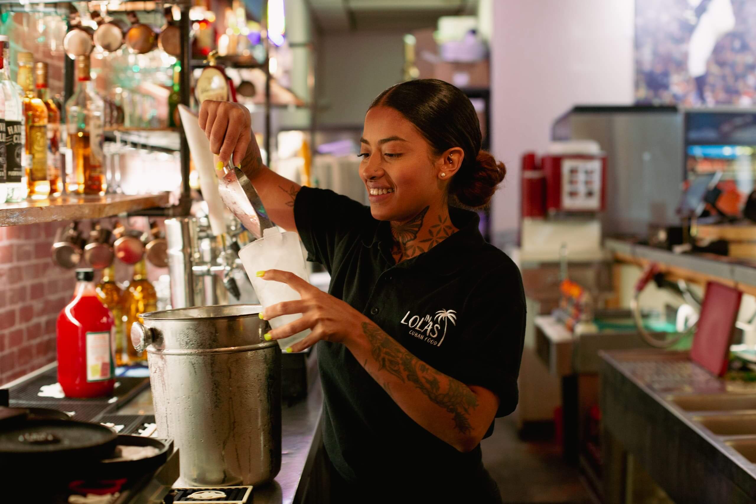 Bartender at Lola's Cuban Restaurant helps even more customers after securing a SBA 7(a) Community Advantage loan