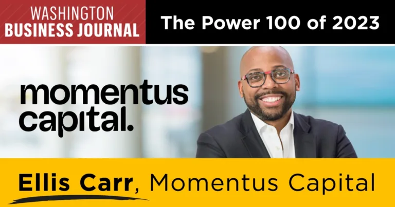 A graphic featuring the logo of the Washington Business Journal, the words "The Power 100 of 2023," the logo for Momentus Capital, a smiling photo of Ellis Carr dressed in a suit with a pair of glasses, and the words "Ellis Carr, Momentus Capital President and CEO."