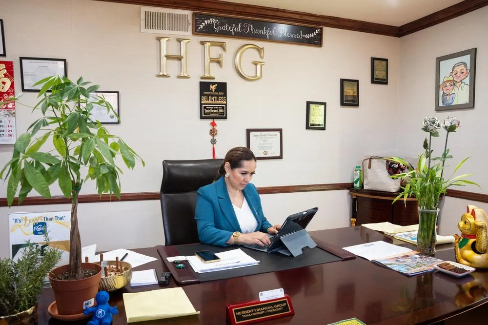 Herbert Financial Group's founder Tania Herbert works in her new HFG office.