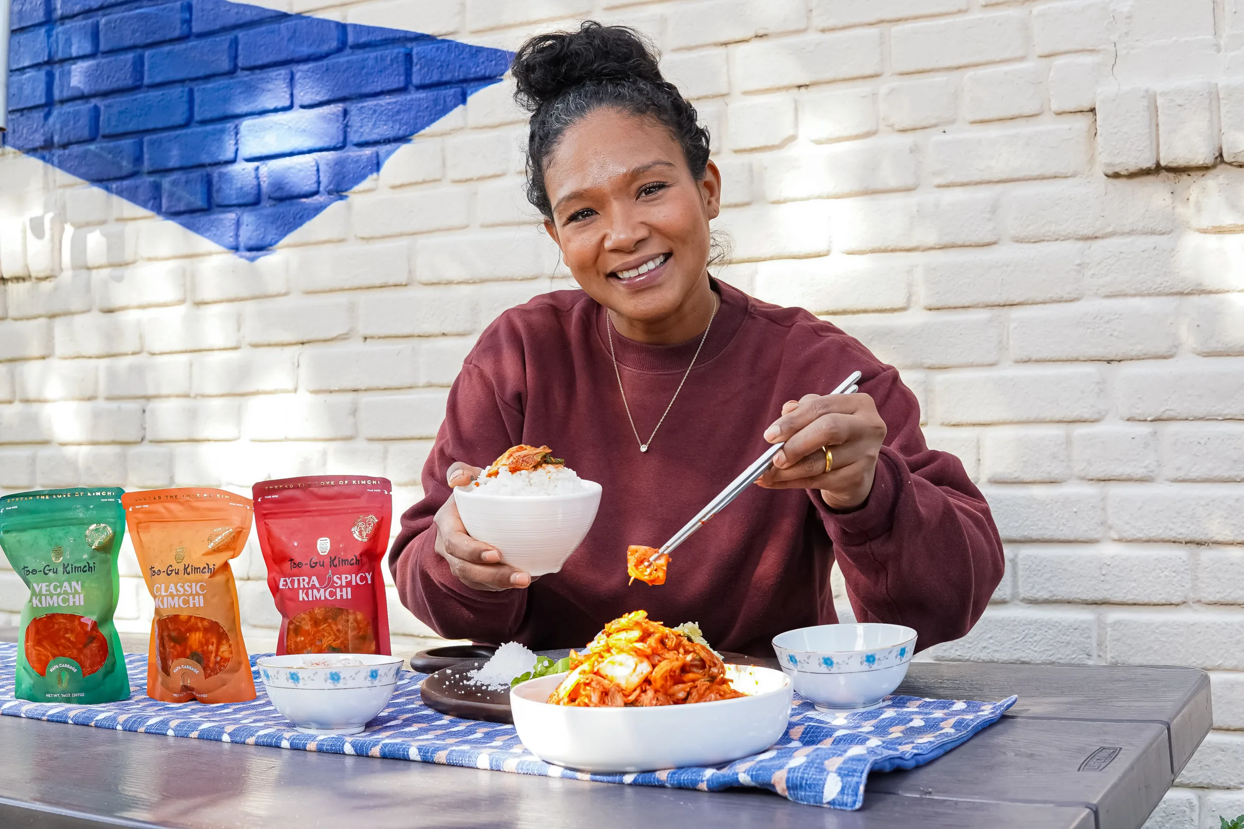 Tae-Gu Kimchi owner, Patrice Cunningham, serving up a tasty treat of Kimchi over rice.