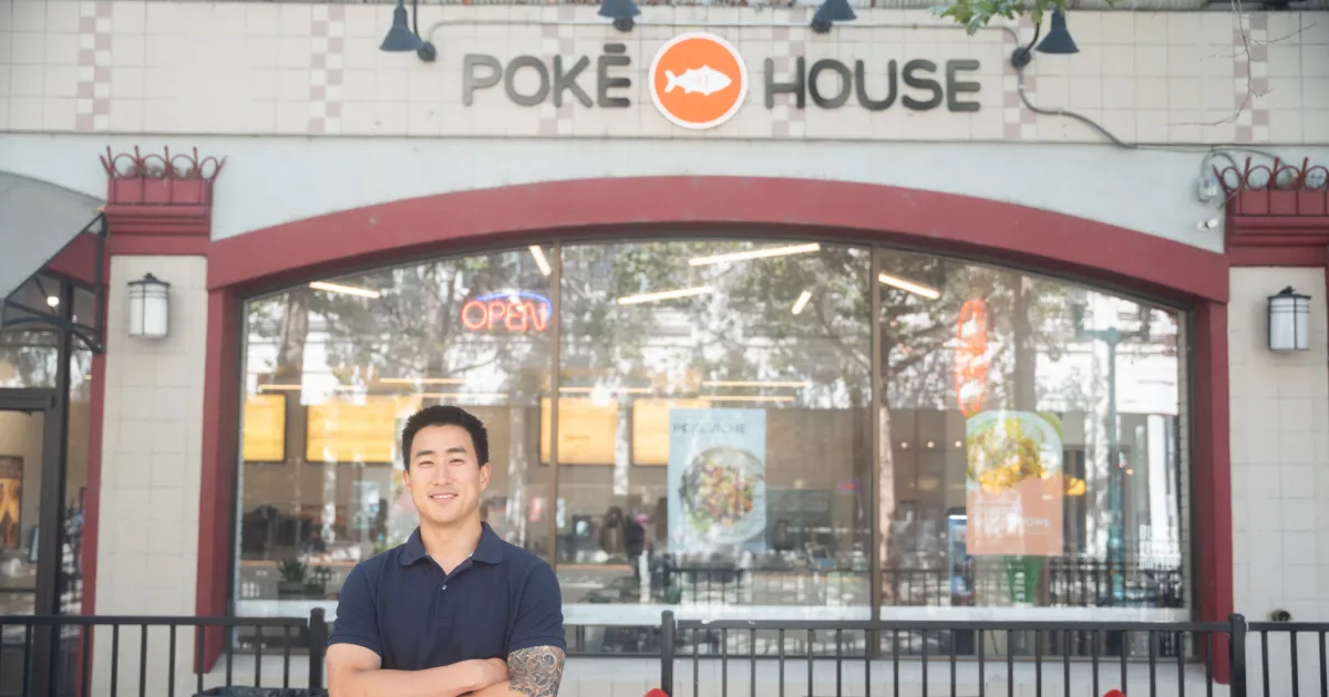 Peter Wong in front of his Santa Cruz Poke House franchise. 