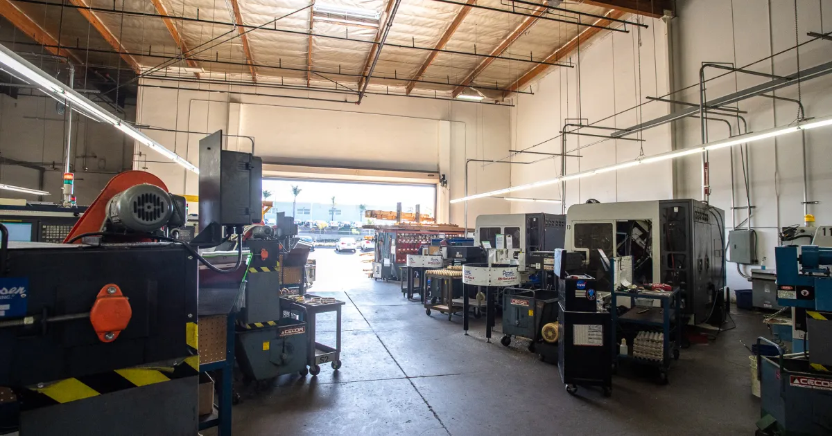Manufacturing facility with industrial machinery and production equipment on a spacious factory floor.